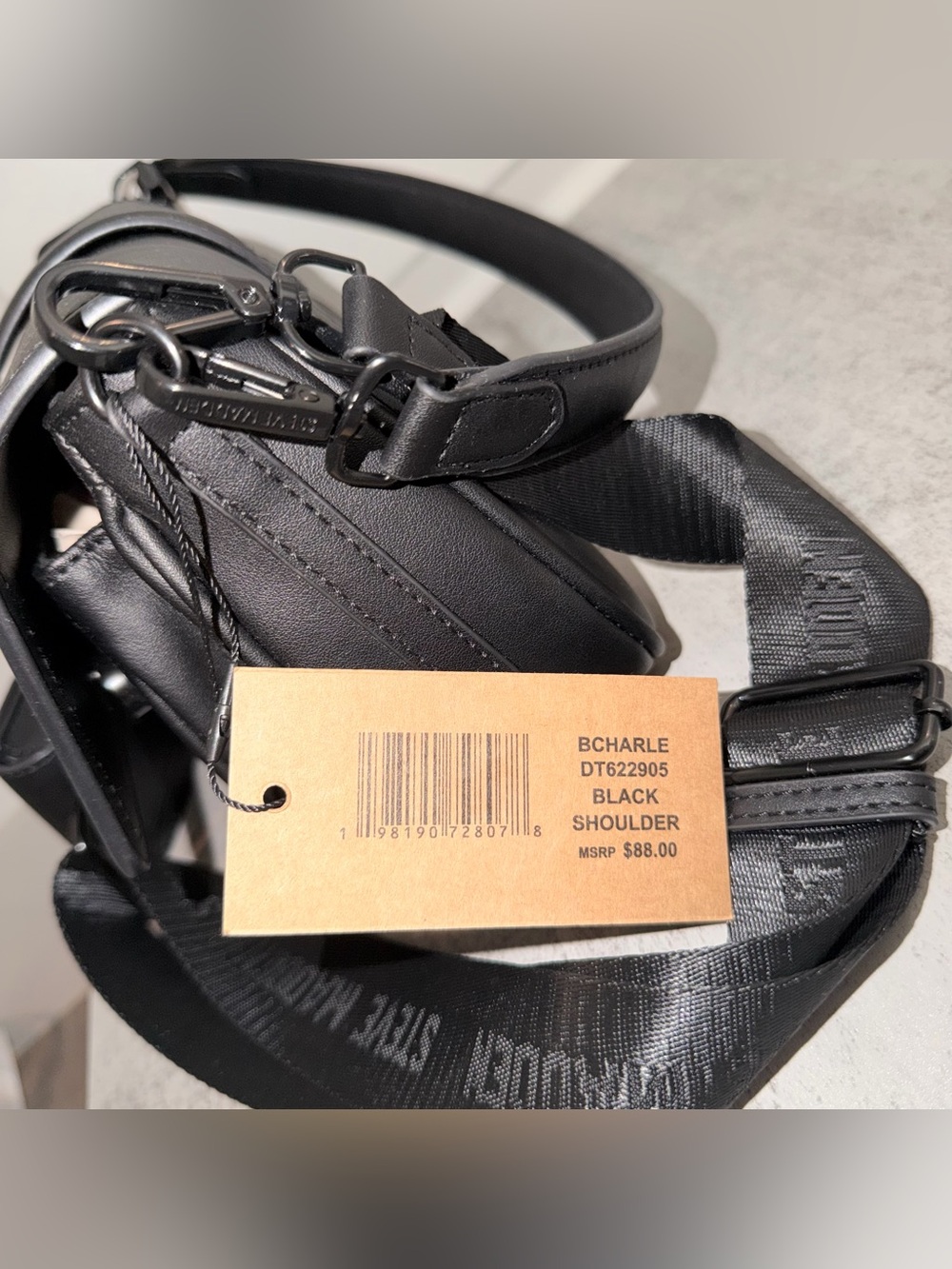 Black Steve Madden Bcharle crossbody bag with a prominent buckled strap detail - Picture 4 of 4